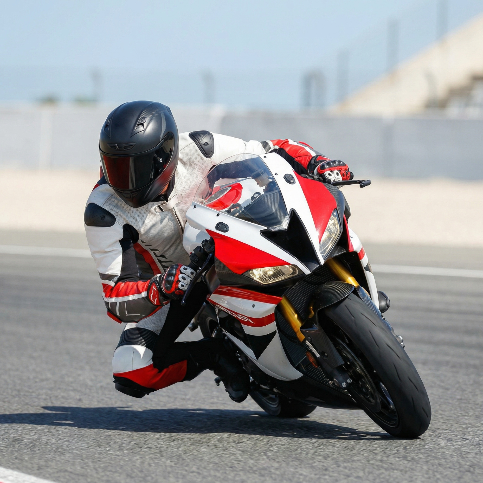 A Prestige Leathers race suit, mid-corner on a sport bike